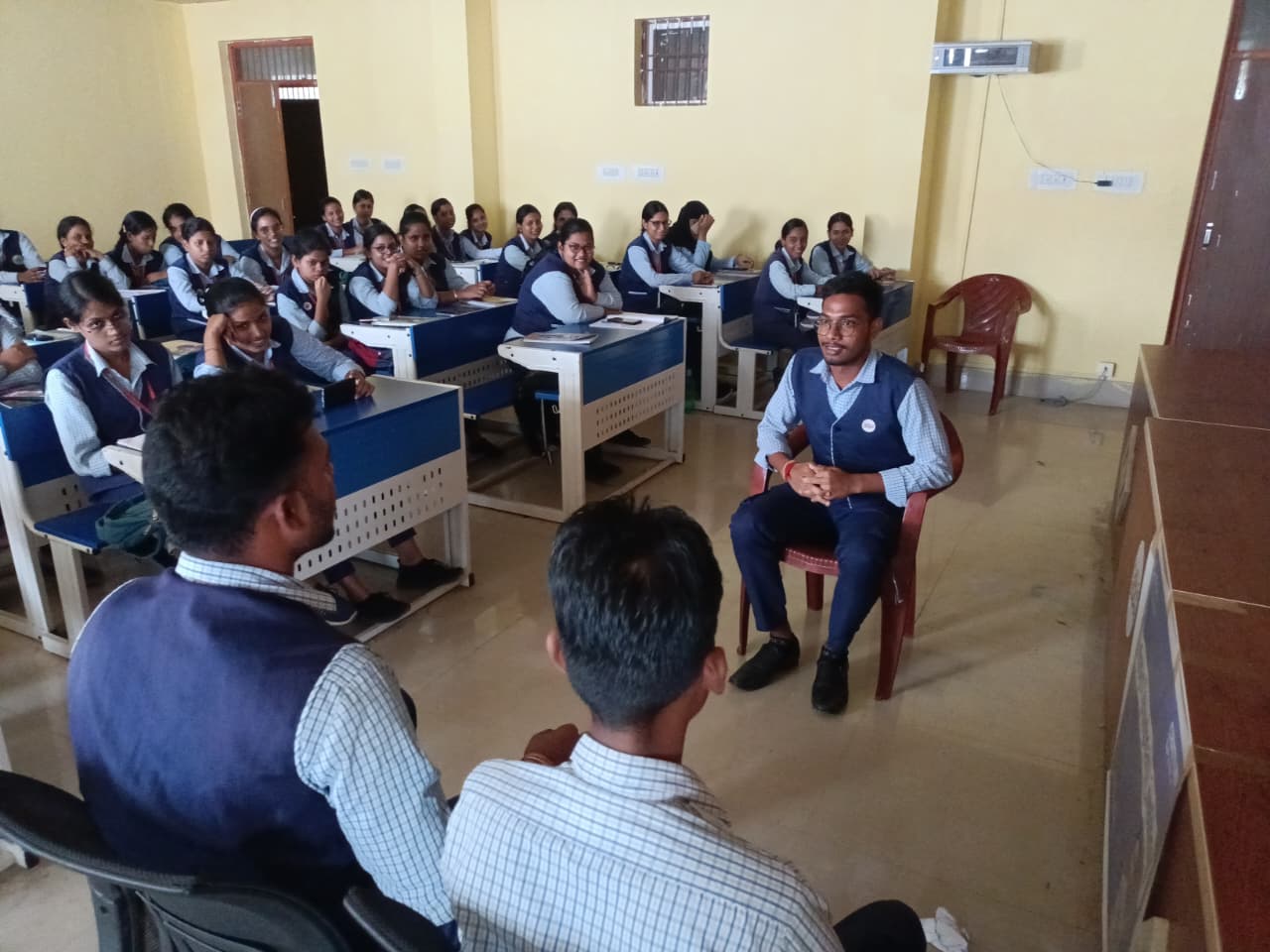A facilitator leading an interactive training session with students