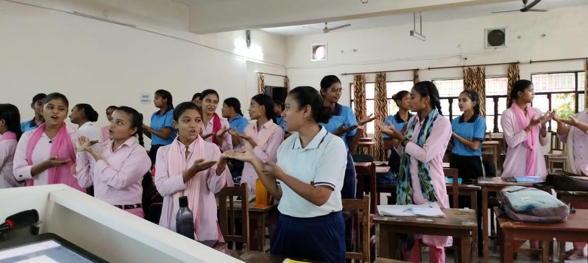 Students seated at desks taking notes during a training session