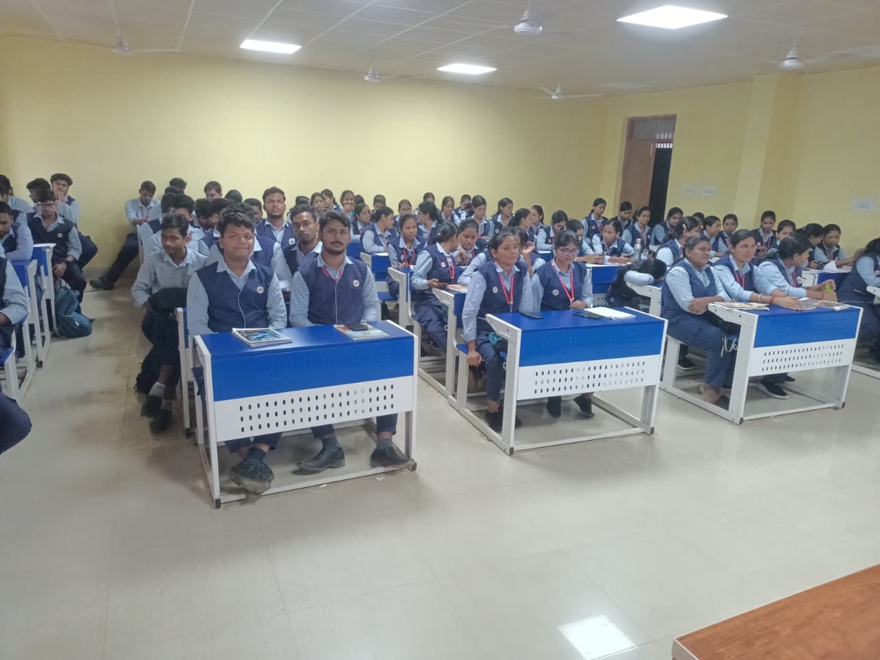 Students attending a training session in a college classroom